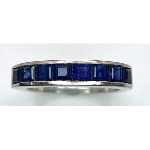 712 - A 18K WHITE GOLD DIAMOND SAPPHIRE BAND RING. TOTAL WEIGHT 5.6G. SIZE K