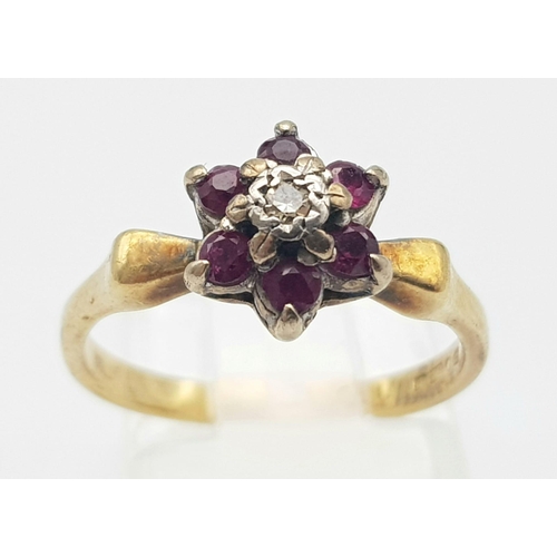 719 - A 18K YELLOW GOLD DIAMOND & RUBY RING. TOTAL WEIGHT 3.2G. SIZE K