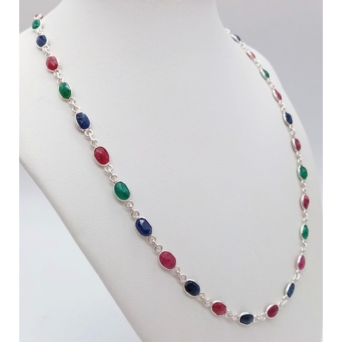 758 - A Ruby, Emerald and Sapphire Chain Necklace. 46cm. 14.3g weight. CD - 1148