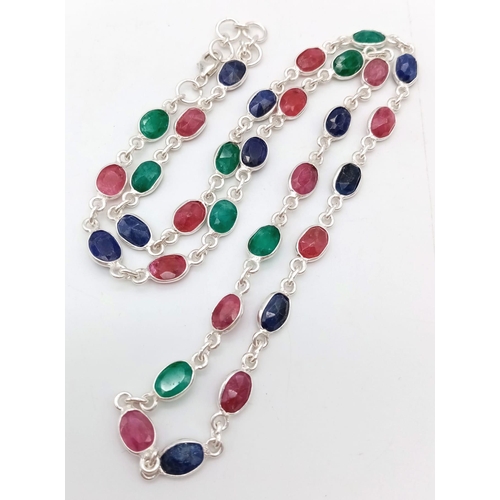 758 - A Ruby, Emerald and Sapphire Chain Necklace. 46cm. 14.3g weight. CD - 1148