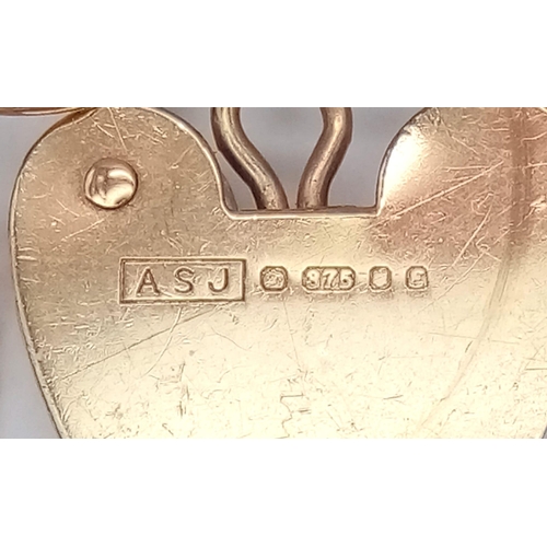 767 - A 9K GOLD 9 GATE BRACELET WITH HEART PADLOCK AND SAFETY CHAIN .    7.2gms