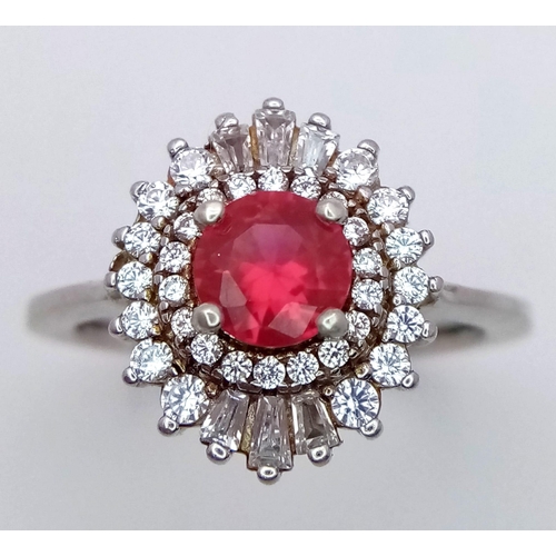 829 - A STUNNING RUBY AND DIAMOND RING SET IN SILVER . 3.4gms   size O