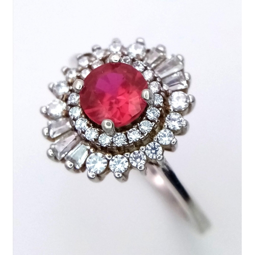 829 - A STUNNING RUBY AND DIAMOND RING SET IN SILVER . 3.4gms   size O