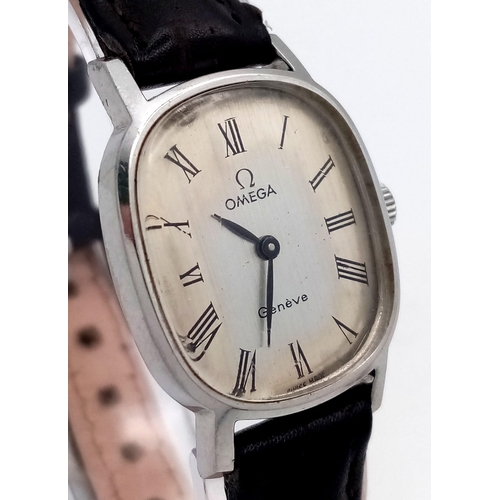 887 - A Vintage Omega Geneve Mechanical Ladies Watch. Black leather strap. Oval case - 21mm width. Aged me... 