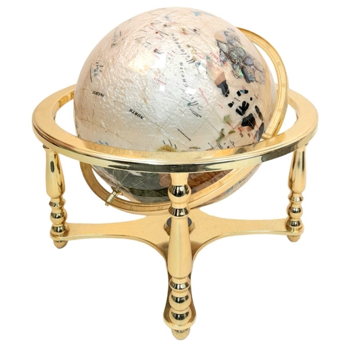 933 - A Mother of Pearl Gemstone Globe. Gilded metal stand. 43cm x 50cm. In good condition.