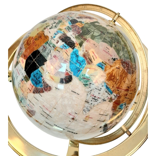 933 - A Mother of Pearl Gemstone Globe. Gilded metal stand. 43cm x 50cm. In good condition.