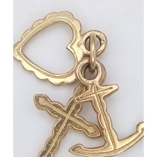 1091 - A 9K YELLOW GOLD HEART, CROSS AND ANCHOR CHARM. TOTAL WEIGHT 1.2G