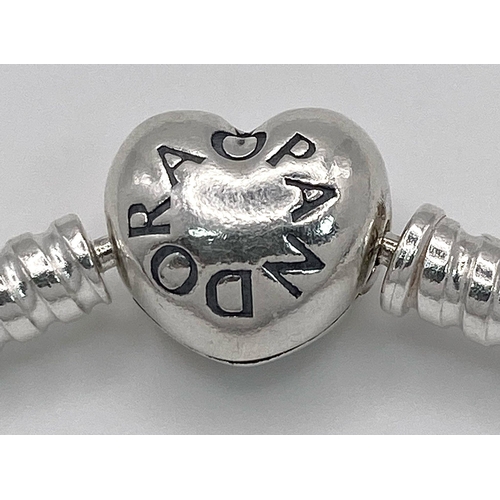 849 - A PANDORA STELRING SILVER MOMENTS BRACELET WITH HEART CLASP 14.7G , 13.3cm 

ref: SC 3123