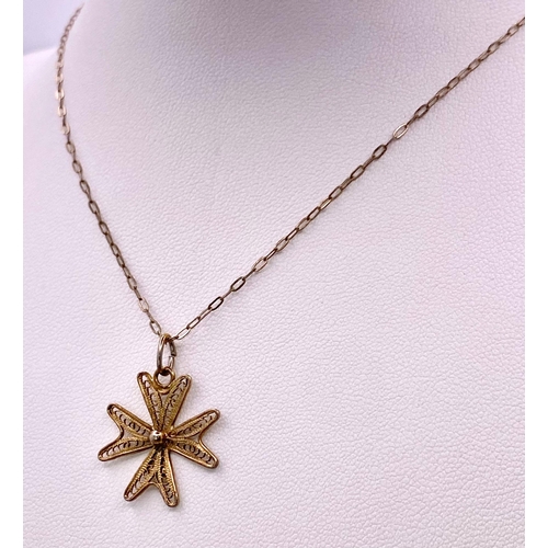 1778 - A 925 gilded silver Filigree Maltese cross pendant on silver chain. Total weight 2G. Total length 40... 