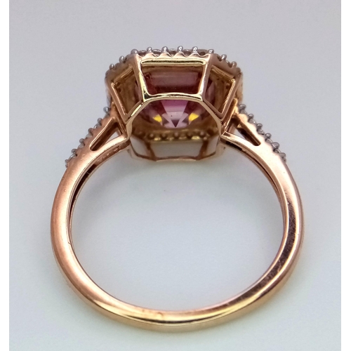 1077 - A 9K ROSE GOLD DIAMOND & PINK STONE RING. TOTAL WEIGHT 3G. SIZE N 1/2