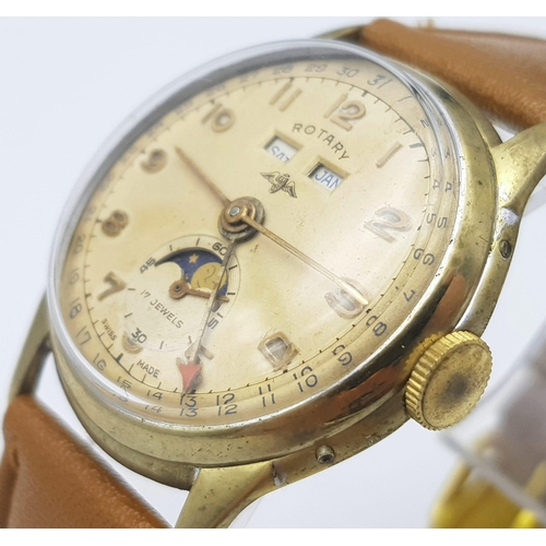 1080 - A VINTAGE ROTARY MOONPHASE WATCH WITH DATE BOX ON A BROWN LEATHER STRAP .  33mm