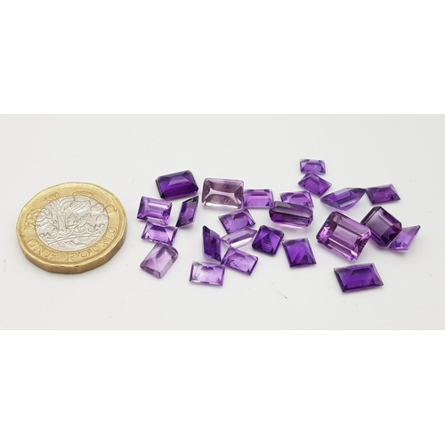 1109 - A Parcel of 24 Amethysts. Rectangle Cuts, Assorted Sizes. 32.1 Carats Total.