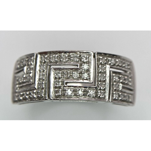 1119 - A 18K WHITE GOLD DIAMOND BAND RING. TOTAL WEIGHT 7.6G. SIZE T