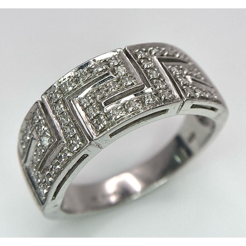 1119 - A 18K WHITE GOLD DIAMOND BAND RING. TOTAL WEIGHT 7.6G. SIZE T