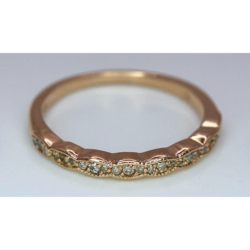 1126 - A 14K ROSE GOLD DIAMOND SET BAND RING. TOTAL WEIGHT 2G. SIZE N