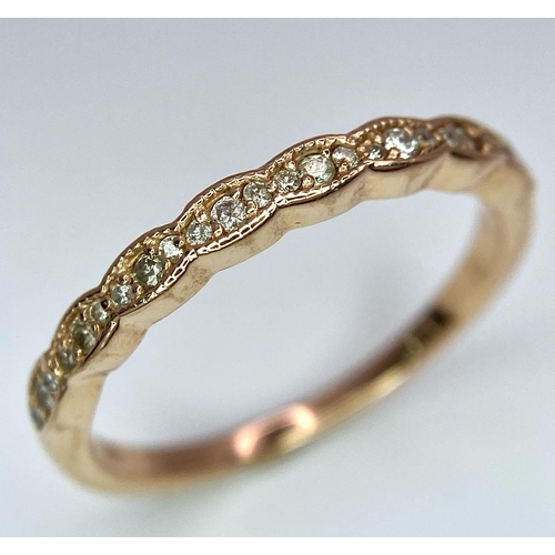 1126 - A 14K ROSE GOLD DIAMOND SET BAND RING. TOTAL WEIGHT 2G. SIZE N