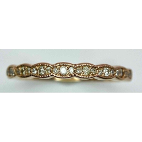 1126 - A 14K ROSE GOLD DIAMOND SET BAND RING. TOTAL WEIGHT 2G. SIZE N