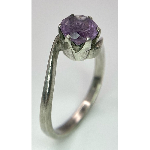 1171 - A vintage 925 silver Amethyst crossover ring. Total weight 3.25G. Size O.