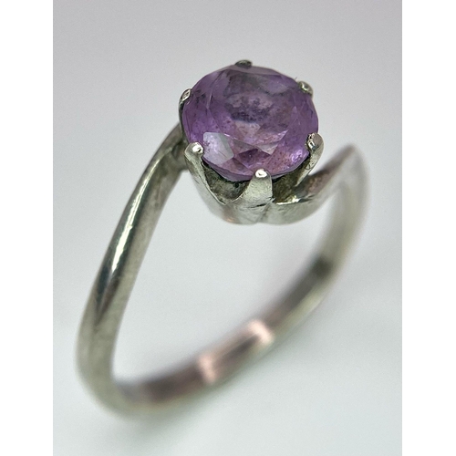 1171 - A vintage 925 silver Amethyst crossover ring. Total weight 3.25G. Size O.