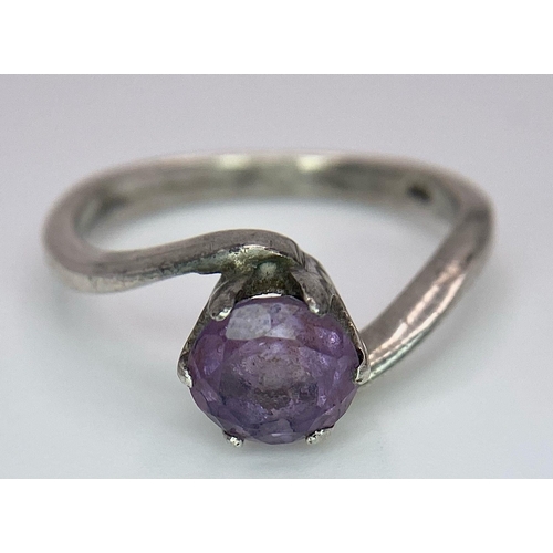 1171 - A vintage 925 silver Amethyst crossover ring. Total weight 3.25G. Size O.