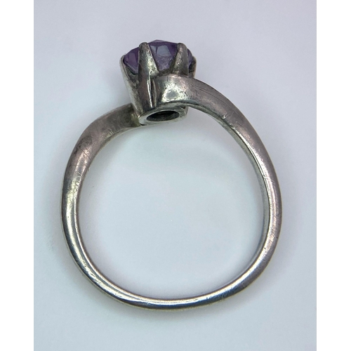 1171 - A vintage 925 silver Amethyst crossover ring. Total weight 3.25G. Size O.