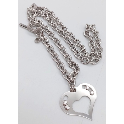 1201 - A SILVER STONE SET NECKLACE WITH HEART PENDANT AND T-BAR FASTENING .   22gms    42cms