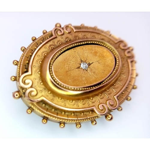 627 - AN ANTIQUE VICTORIAN 15K GOLD MOURNING BROOCH WITH BEAUTIFUL HAND ENGRAVING AND DIAMOND CENTRE STONE... 