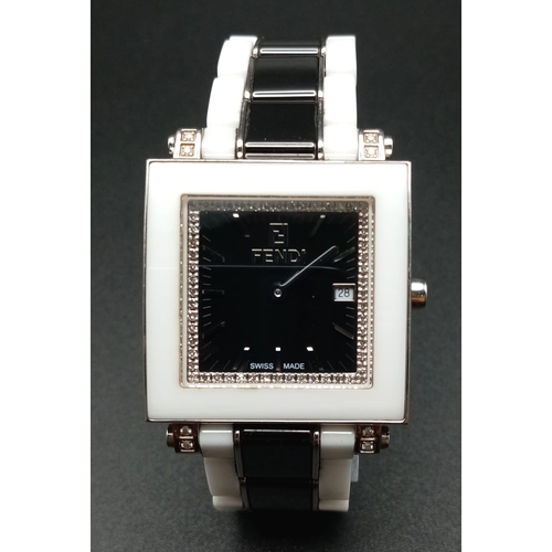 680 - A Fendi Designer Ladies Watch. Ceramic and steel bracelet and case - 31mm. Black dial with date wind... 