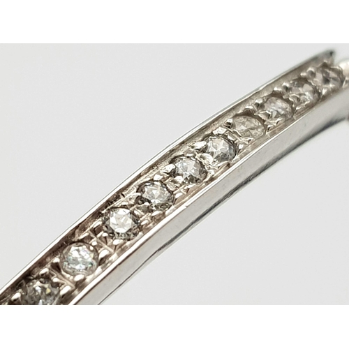 688 - A 14K WHITE GOLD AND DIAMOND SECTIONED BRACELET WITH SAFETY CATCH  .   13.8gms