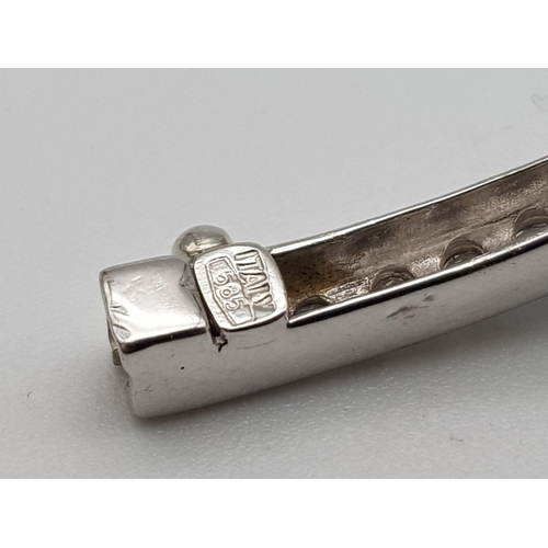 688 - A 14K WHITE GOLD AND DIAMOND SECTIONED BRACELET WITH SAFETY CATCH  .   13.8gms