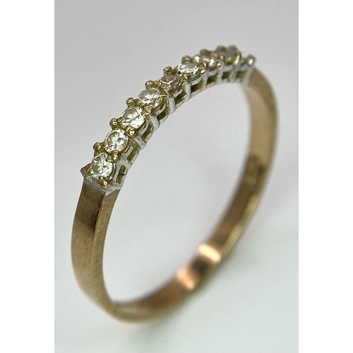 803 - A 9K YELLOW GOLD 0.25CT  DIAMOND BAND RING. TOTAL WEIGHT 1.2G. SIZE SIZE M 1/2