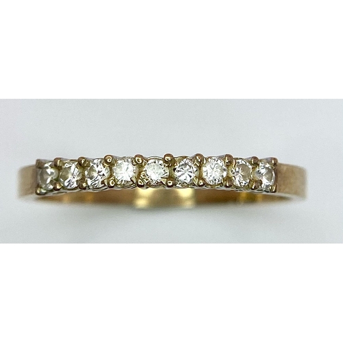 803 - A 9K YELLOW GOLD 0.25CT  DIAMOND BAND RING. TOTAL WEIGHT 1.2G. SIZE SIZE M 1/2