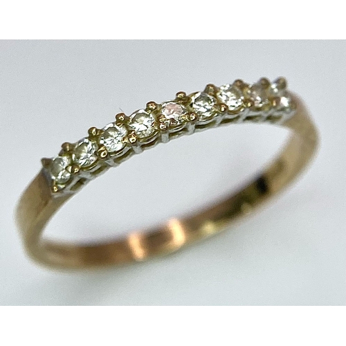 803 - A 9K YELLOW GOLD 0.25CT  DIAMOND BAND RING. TOTAL WEIGHT 1.2G. SIZE SIZE M 1/2