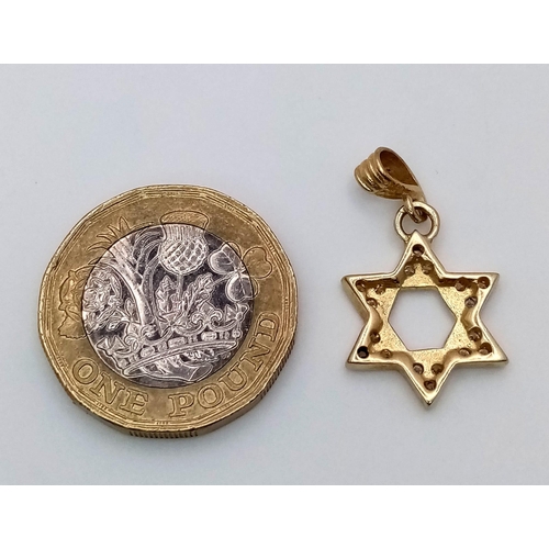 806 - A Diamond Encrusted Star of David pendant. 3cm