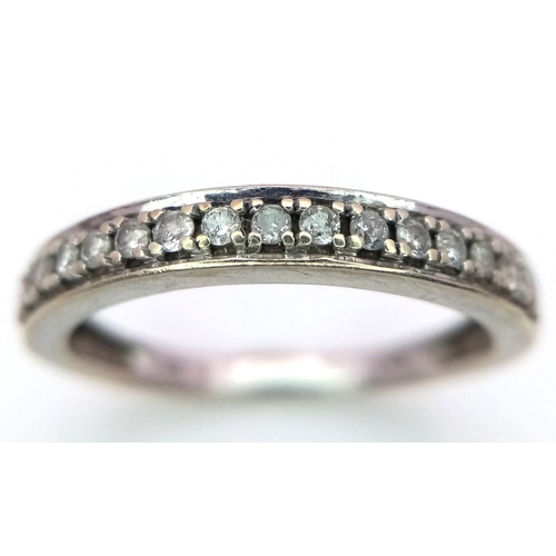 884 - A 9K Gold and Diamond Half Eternity Ring. 0.20ctw. Size N. 2g total weight.