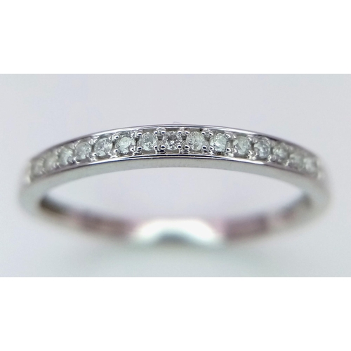 944 - A 9K WHITE GOLD 0.11CT DIAMOND SET BAND RING. TOTAL WEIGHT 2G. SIZE R