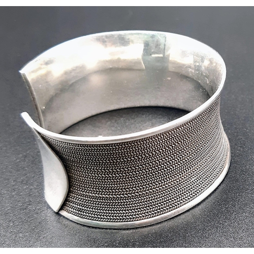 984 - A 925 Silver Wide Cuff Bangle. 3cm width. 55g weight.