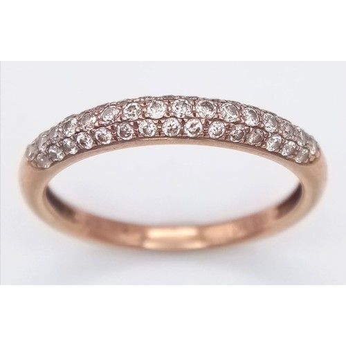 1000 - A 9K ROSE GOLD 0.33CT DIAMOND BAND RING. TOTAL WEIGHT 1.6G. SIZE O