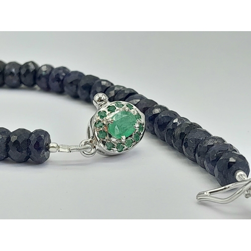 1331 - A 120ctw Faceted Rondelle Blue Sapphire Bracelet with Emerald Clasp, set in 925 Silver. 20cm. 23.75g... 