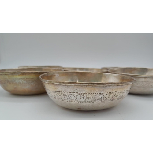 1455 - A SET OF 6 800 SILVER ISLAMIC CEREMONIAL DISHES . 12cms DIAMETER  498gms