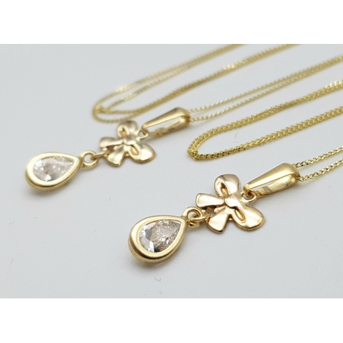 908 - Two 9K Yellow Gold Disappearing Necklaces with White Stone Pendants. 40cm necklace lengths. 1.45g to... 