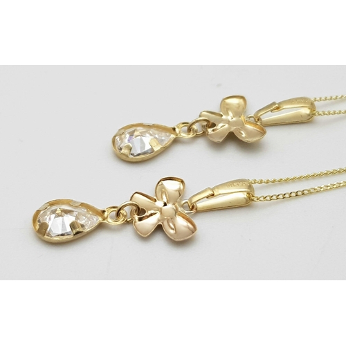 908 - Two 9K Yellow Gold Disappearing Necklaces with White Stone Pendants. 40cm necklace lengths. 1.45g to... 