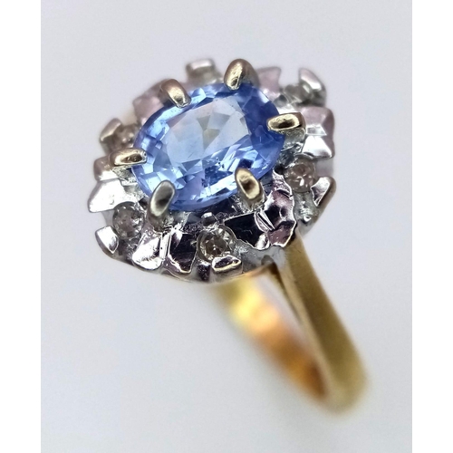 1383 - An 18K Yellow Gold Sapphire and Diamond Cluster Ring. Size K. 3.75g total weight.