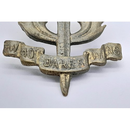 896 - WW2 Theatre Made S.A.S Cap Badge. A typical Middle Eastern sand cast badge of the period.