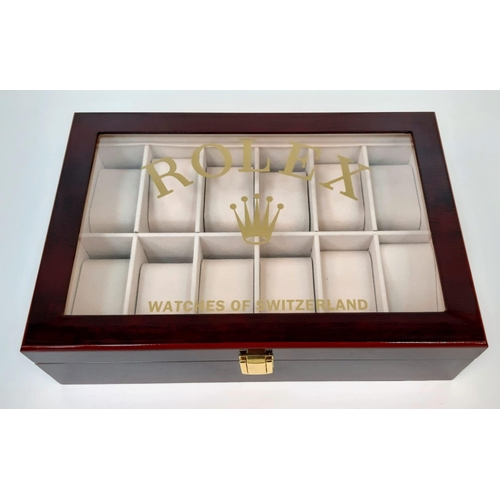 1566 - An Unused  12 Watch Display Case. 31.5x21.5x8.5cm. Rich Piano Finish Cherry Wood. Marked with Rolex ... 