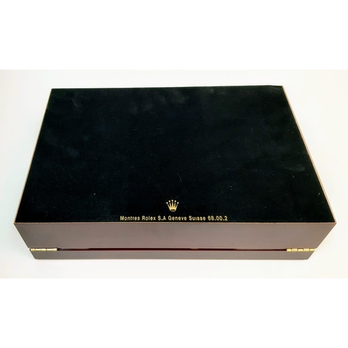 1566 - An Unused  12 Watch Display Case. 31.5x21.5x8.5cm. Rich Piano Finish Cherry Wood. Marked with Rolex ... 