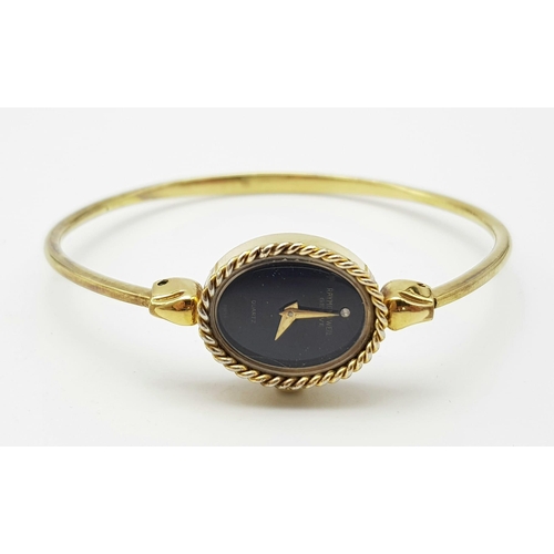 1215 - A Gilded Raymond Weil Ladies Quartz Watch. Gilded clip open bangle bracelet. Oval case - 16mm. Black... 