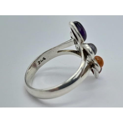 1231 - A STERLING SILVER MULTI STONE SET RING, IN THE FLORAL DESIGN 4.2G SIZE P

ref: SC 3120