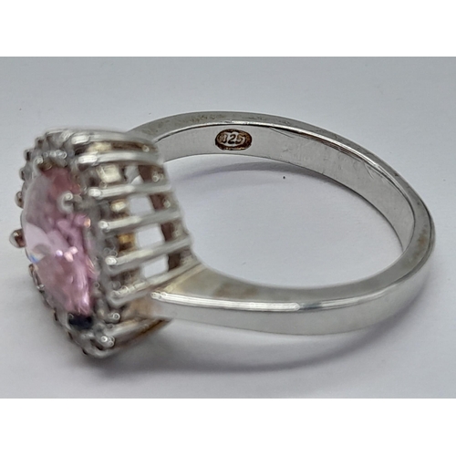 1303 - A STERLING SILVER PINK AND WHITE STONE SET IN THE HEART SHAPED CLUSTER RING 4G SIZE J 1/2

ref: SC 3... 