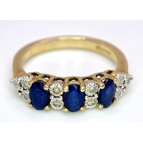 1311 - A Three Stone Sapphire and Diamond 9K Yellow Gold Ring. Size L. 2.53g total weight.